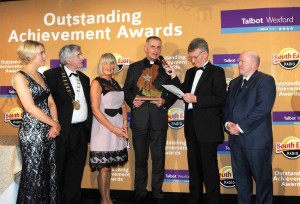 Fr Sean Devereax receiving his Overall Outstanding Achievement Award 2015 form Breda Morrison, Tony Dempsey, Lisa Carmody, Alan Corcoran and Michael Carruth